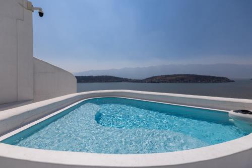 a swimming pool with a view of the water at 大理松云悬崖酒店 in Dali Ancient Town