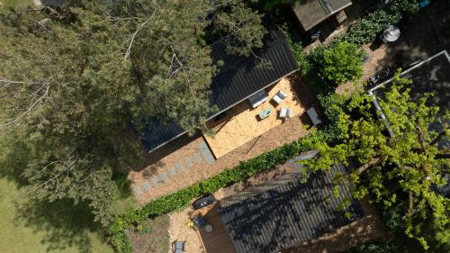 an overhead view of a building with a fence and trees at Boswilg in Zuidwolde