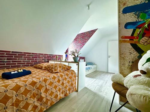 Ένα ή περισσότερα κρεβάτια σε δωμάτιο στο Maison chaleureuse au calme