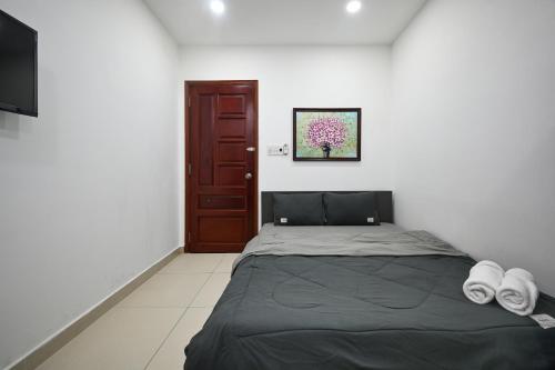 Postel nebo postele na pokoji v ubytování Bear's House Sư Vạn Hạnh