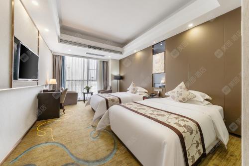 Ein Bett oder Betten in einem Zimmer der Unterkunft Ramada by Wyndham Zhangjiajie