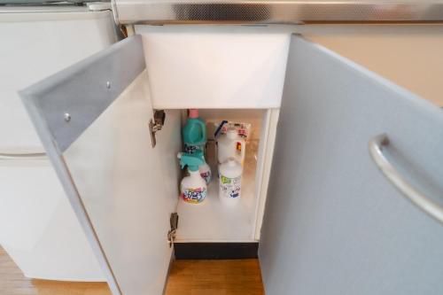 an open refrigerator with milk and eggs in it at TIDA Ishigaki in Ishigaki Island