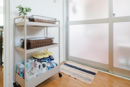a room with a shelf with toiletries at TIDA Ishigaki in Ishigaki Island