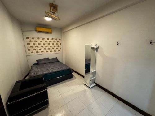 Postel nebo postele na pokoji v ubytování W33d Gallery Pattaya