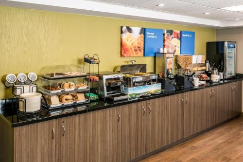 a buffet line in a restaurant with food at Comfort Inn in Truro