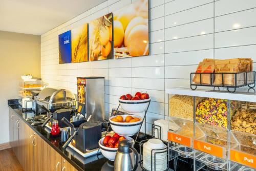 a kitchen with a counter with some food at Comfort Inn in Charlottetown