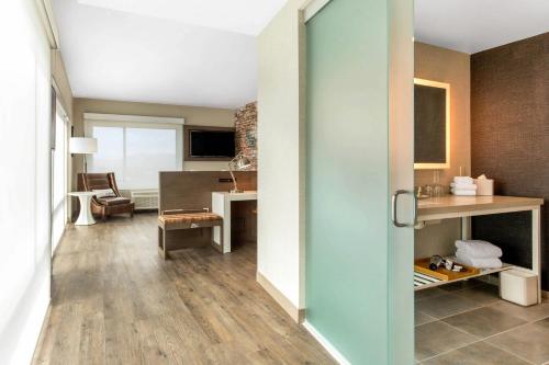 an open door to a kitchen and a living room at Cambria Hotel Downtown Asheville in Asheville