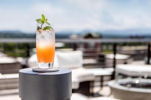 a drink sitting on top of a table at Cambria Hotel Downtown Asheville in Asheville