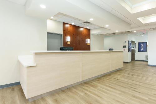 an office with a reception desk in a room at Comfort Suites University Drive in College Station