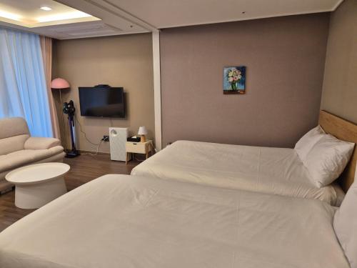 Katil atau katil-katil dalam bilik di The solid residence - Elbon the stay by haeundae