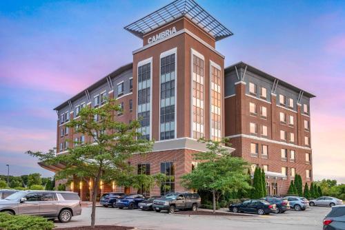 a rendering of a building with cars parked in a parking lot at Cambria Hotel Madison East in Madison