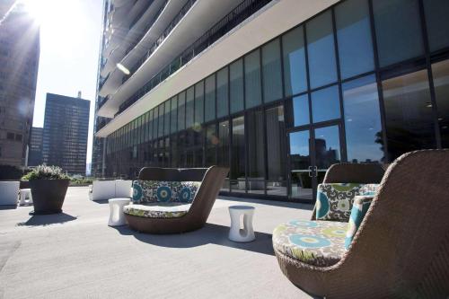 a group of chairs sitting outside of a building at Radisson Blu Aqua Hotel, Chicago in Chicago