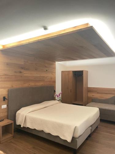 Ένα ή περισσότερα κρεβάτια σε δωμάτιο στο Albergo Silvana
