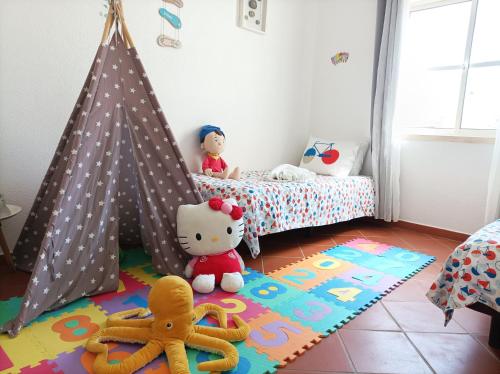 a childs bedroom with a teepee bed and toys at Marreiro's house Algarve - Child friendy - Private Pool in Lagos
