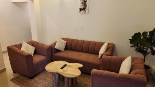 a living room with a couch and a coffee table at Close2C By The Arks Villa in Anjuna