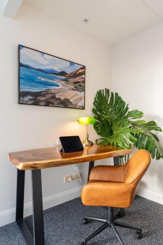 an office with a desk with a laptop and a chair at 'The Australia St-ar' 2x King beds in Sydney
