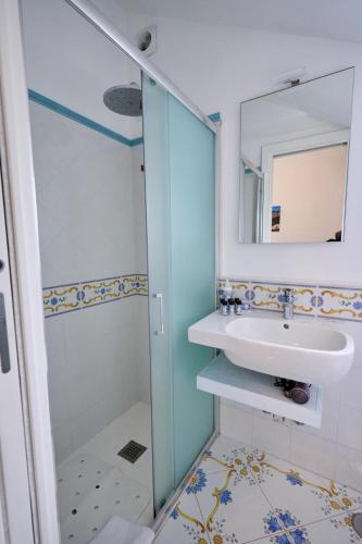 a bathroom with a sink and a shower at Casa Nannina in Anacapri