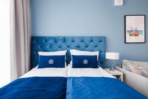 Postel nebo postele na pokoji v ubytování INA Rent - Śląska 12