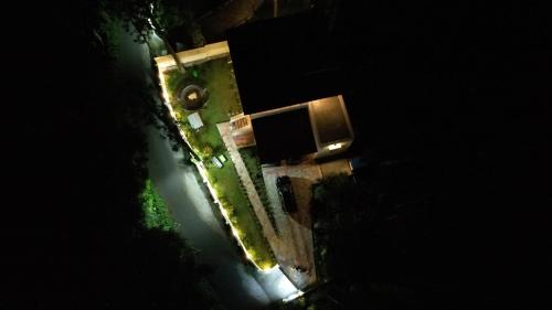 an overhead view of a building at night with lights at Vamsi's Woodside in Yercaud