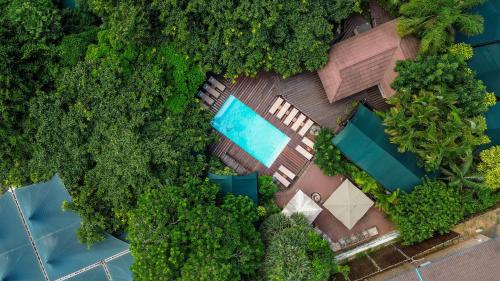 an overhead view of a resort with a swimming pool and trees at Luxury Tented Village @ Urban Glamping in St Lucia