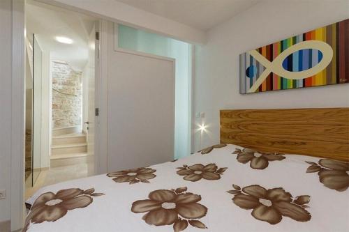 a bedroom with a bed with flowers on it at Bale Luxury House in Bale
