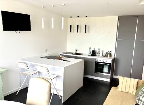 Η κουζίνα ή μικρή κουζίνα στο FabFour Apt CENTRALE - Piazza Fontana