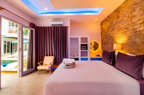 Ένα ή περισσότερα κρεβάτια σε δωμάτιο στο Cocotoa Boutique Hotel & Villa