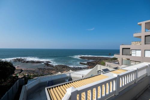 a view of the ocean from the balcony of a building at Le Roc 10 in Ballito