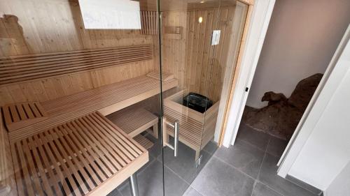 a sauna with two wooden benches in a room at Calma Suites Tejeda in Tejeda