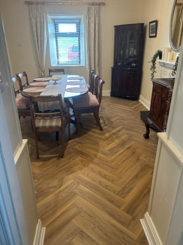 a dining room with a table and chairs and a dining room at Luxury 4 bedroom lodge in Doolin in Doolin