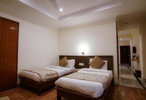 Katil atau katil-katil dalam bilik di Tulip Inn Green Castle Mall road