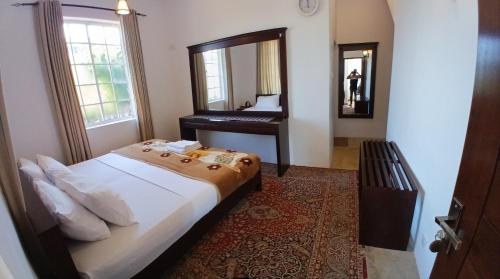 Postel nebo postele na pokoji v ubytování Terrabella - Nuwara Eliya