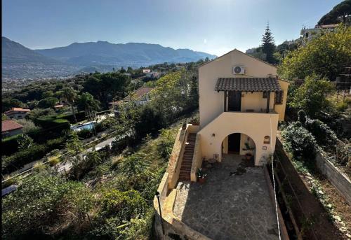 a small white church on a hill with a view at Casale di Sicilia in Monreale