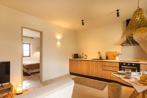 a kitchen with a sink and a counter top at Vila Laura in Porto Covo