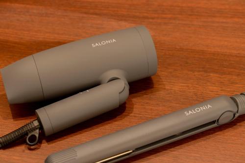 a close up of a stapler and a pen on a table at Fantasy Lodge in Tokyo