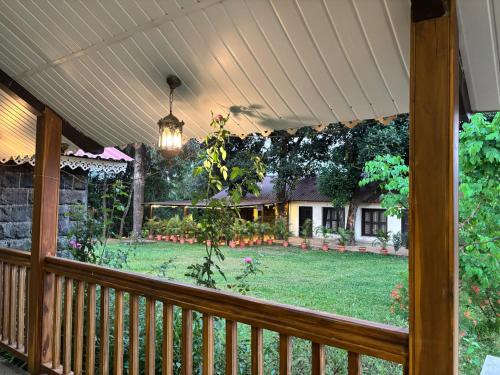 a porch with a view of a yard at Madhuvan Retreat Resort Amba in Chandoli