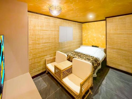Ένα ή περισσότερα κρεβάτια σε δωμάτιο στο Hotel BaliBali 熊本