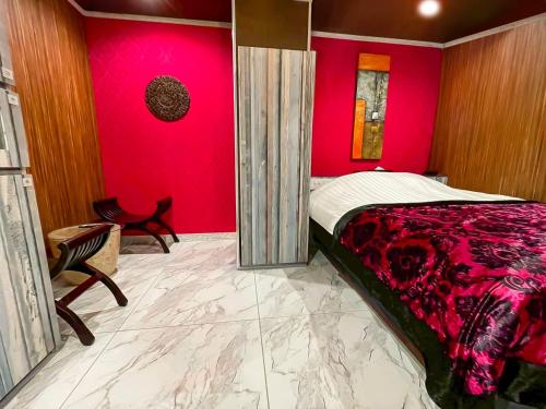 Ένα ή περισσότερα κρεβάτια σε δωμάτιο στο Hotel BaliBali 熊本