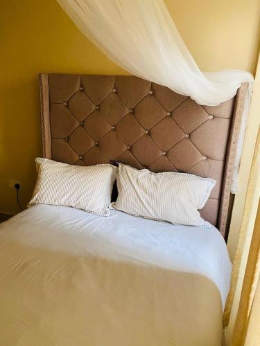 Postel nebo postele na pokoji v ubytování M&J Homes