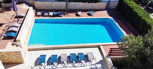an overhead view of a swimming pool with lounge chairs at Villa Marijeta Hvar in Hvar