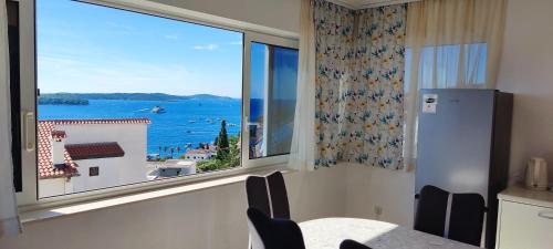 a kitchen with a window with a view of the ocean at Villa Marijeta Hvar in Hvar