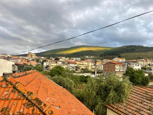 a view of a city with orange roofs at Casa do Canto in Torre de Moncorvo