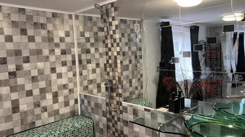 a bathroom with a sink and a mirror at Pensiunea Bavaria Campina in Campina