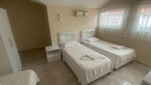 Postel nebo postele na pokoji v ubytování Dalyan Vira Hotel