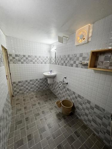 a bathroom with a sink and a toilet at Beach Heaven by Azure Heaven Holidays Pvt ltd in Mararikulam