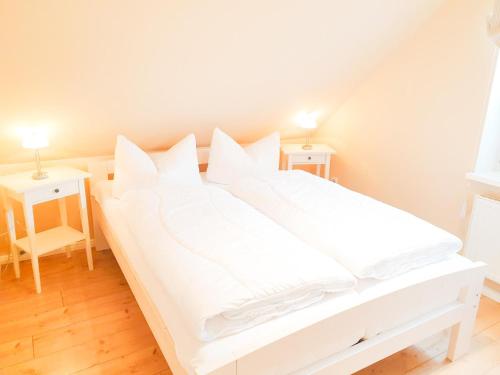 Ένα ή περισσότερα κρεβάτια σε δωμάτιο στο Ferienhaus Deichtraum