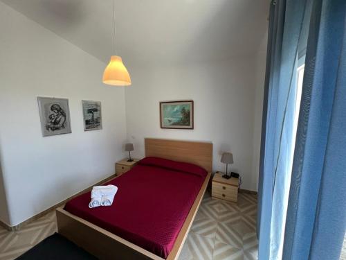 Postel nebo postele na pokoji v ubytování Terra Di Mare