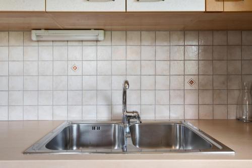 a stainless steel sink in a kitchen at Prackfolerhof in Fie allo Sciliar
