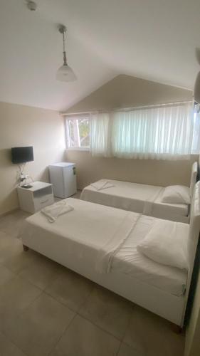 Postel nebo postele na pokoji v ubytování Dalyan Vira Hotel