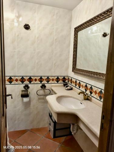 a bathroom with a sink and a mirror at O Chanto in Cedeira